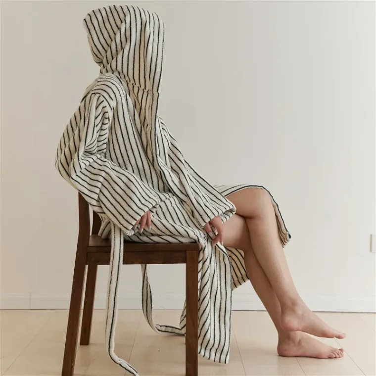 Detailed view of handwoven textile with earthy tones.