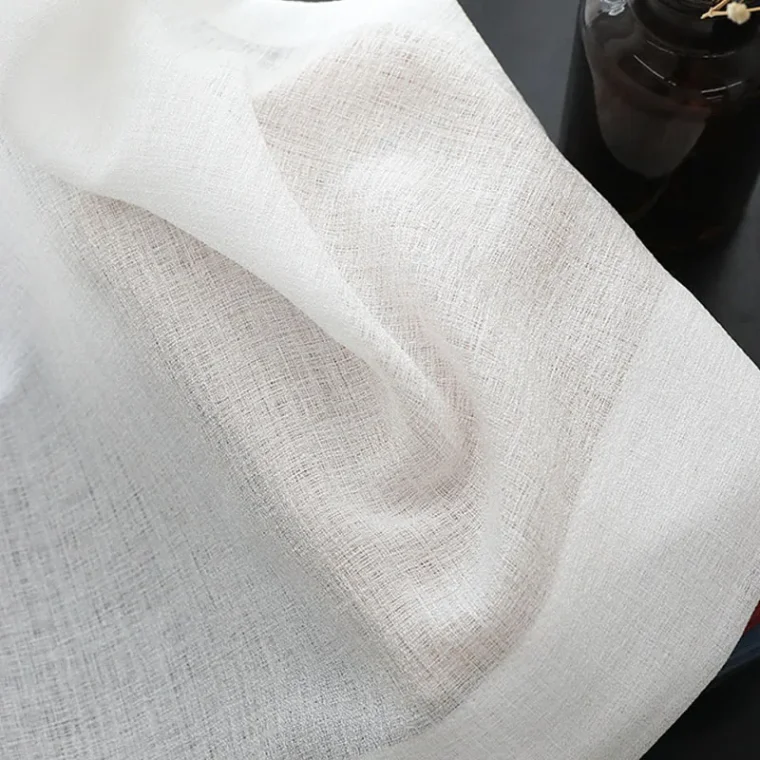 Close-up of woven fabric texture with detailed threads.