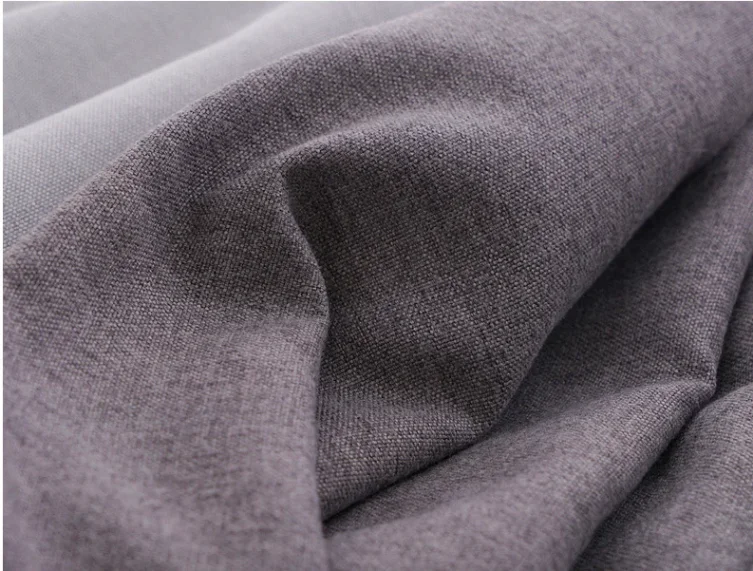 Natural cotton fabric with geometric patterns.