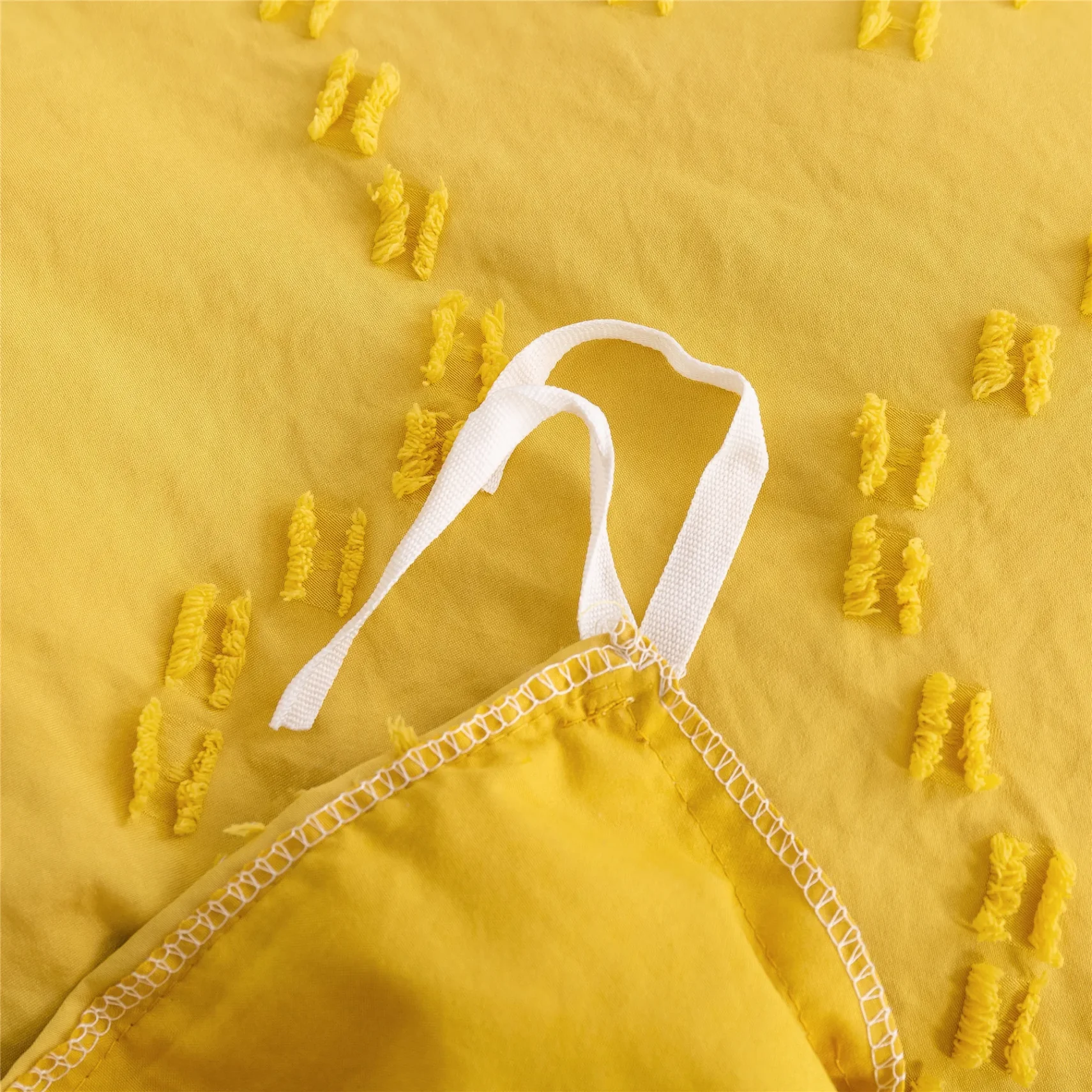 Close-up of woven fabric texture with detailed patterns.