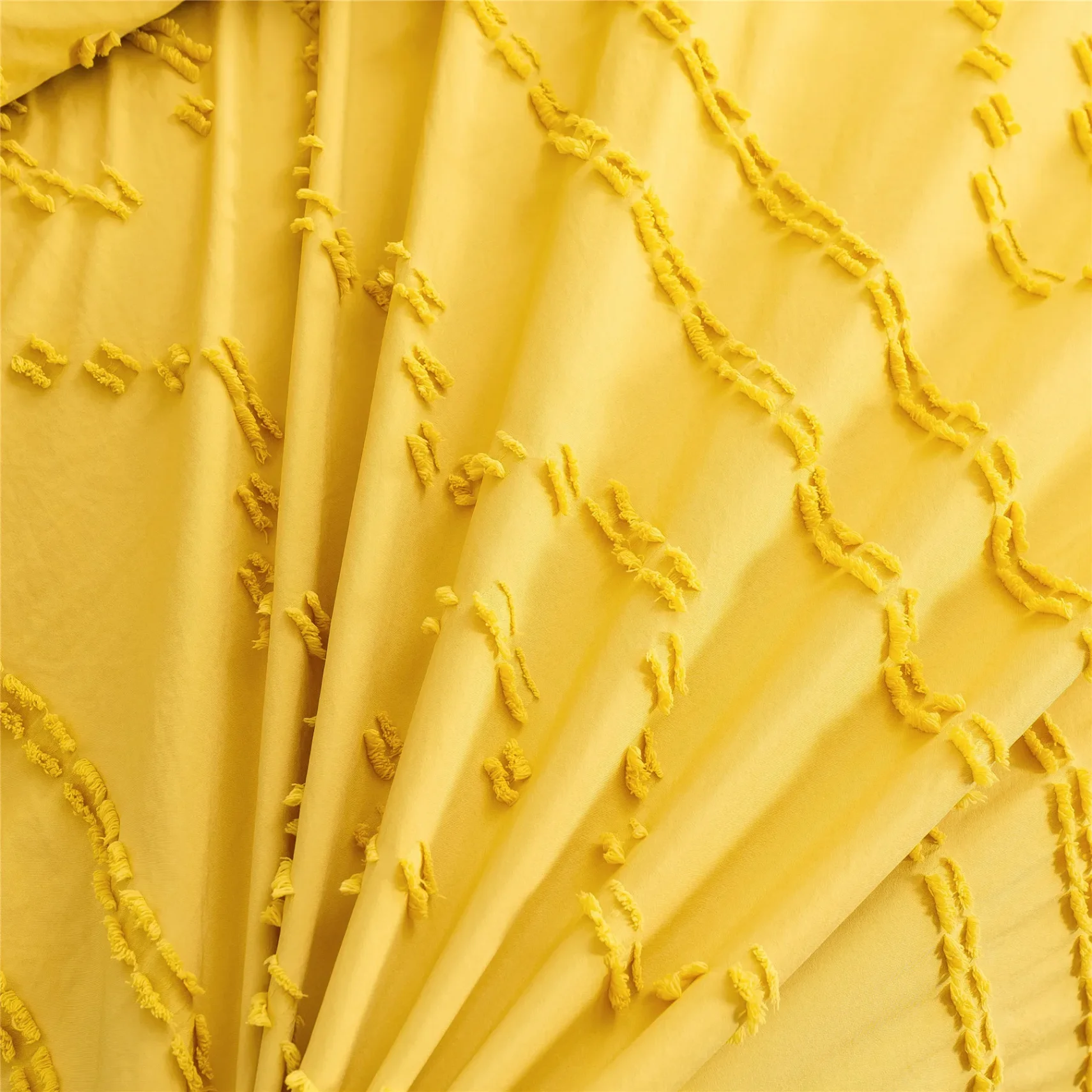 Modern textile sample with geometric patterns and bold colors.