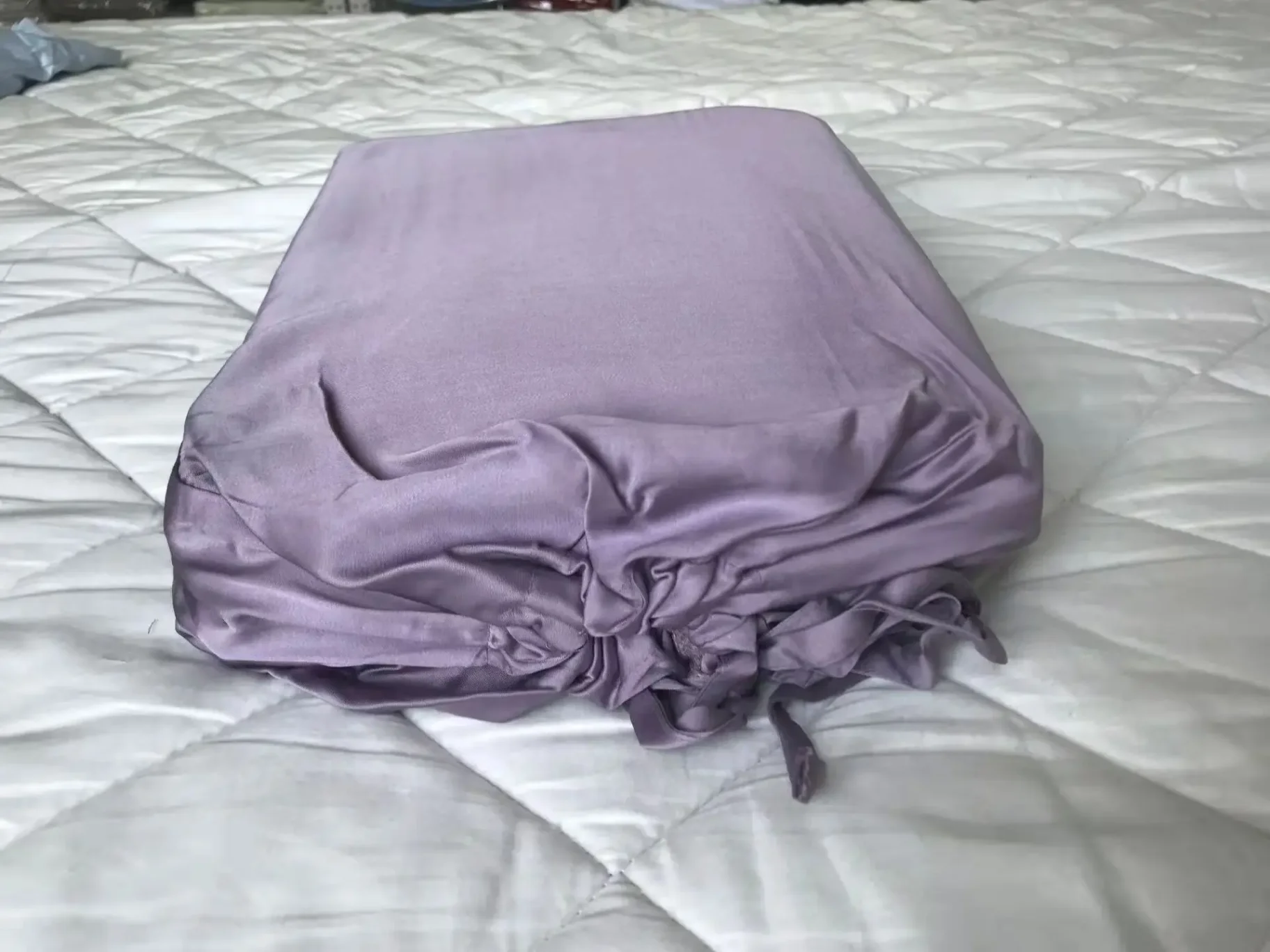 Close-up of smooth satin fabric with sheen